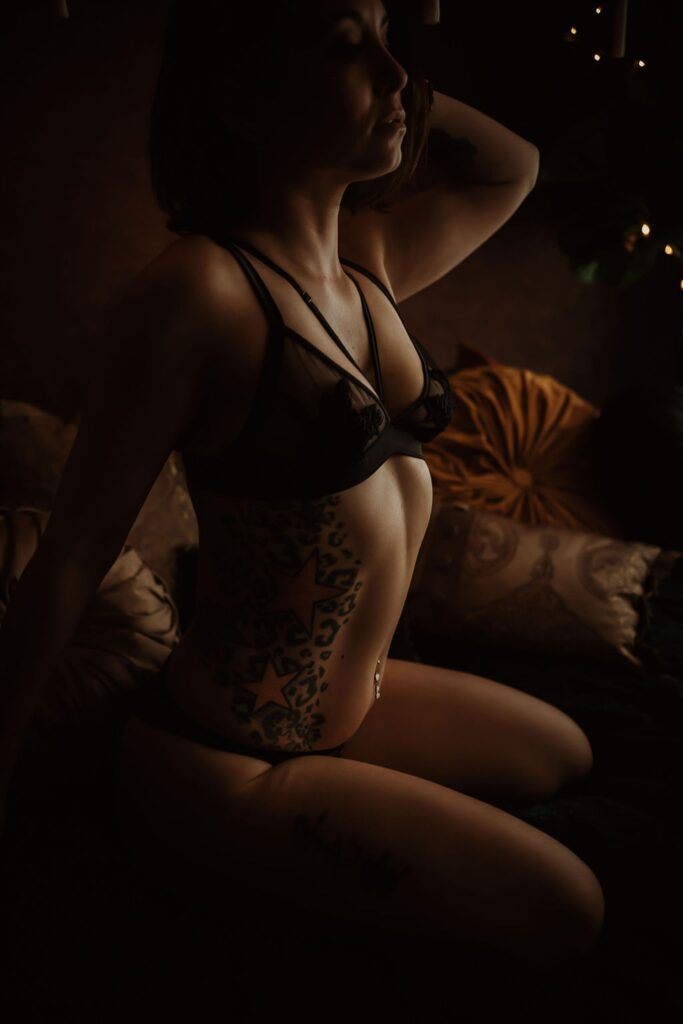 closeup of a woman's body in lingerie on a bed